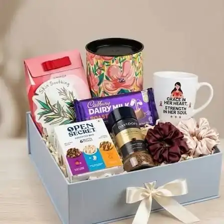 Wellness gift hamper with mug, chocolates and snacks for new joiners